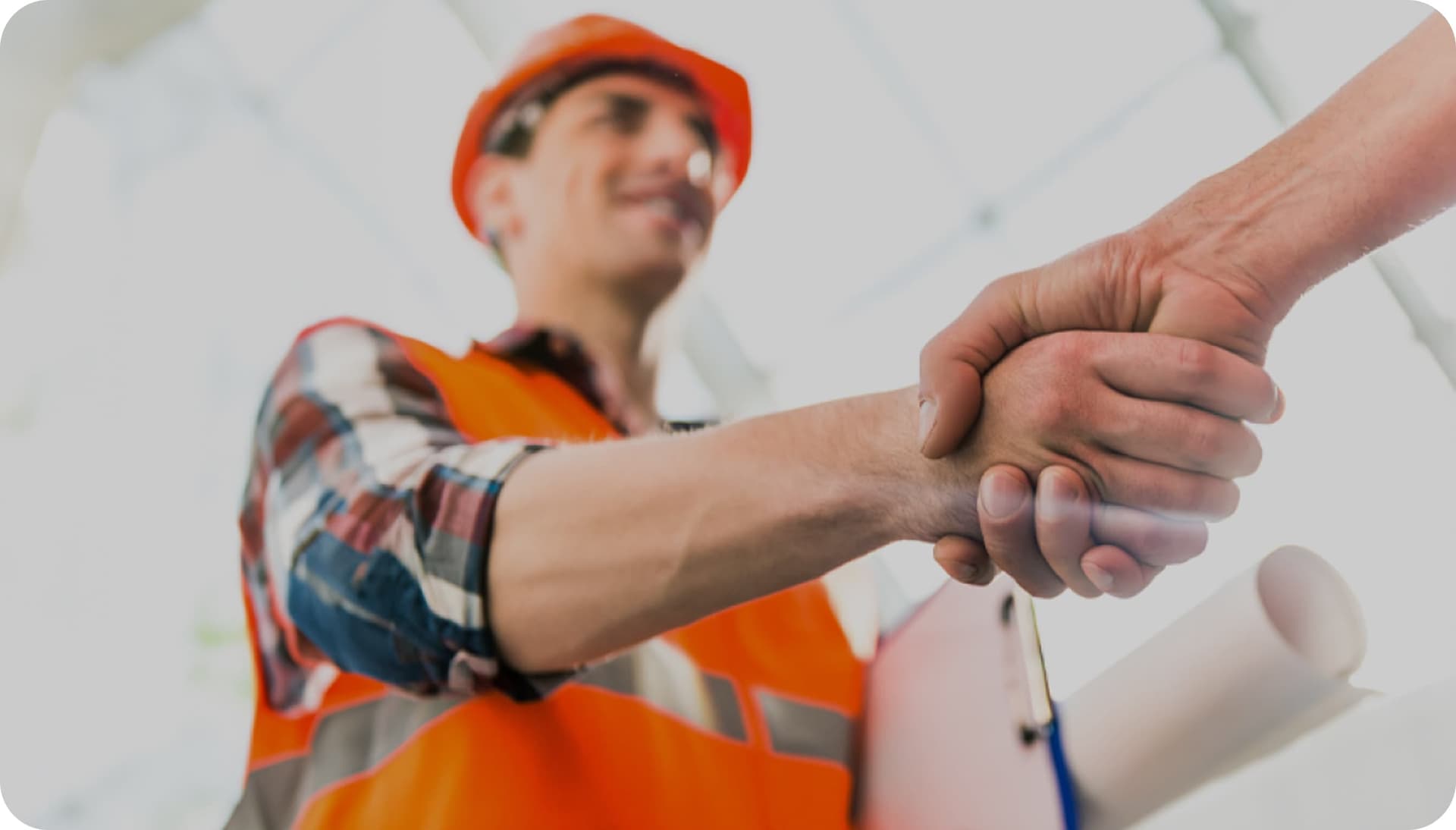 GoBuid interface showing a construction worker in a red hard hat using a tablet, with smartphones displaying the app's mission control and GPS location features.