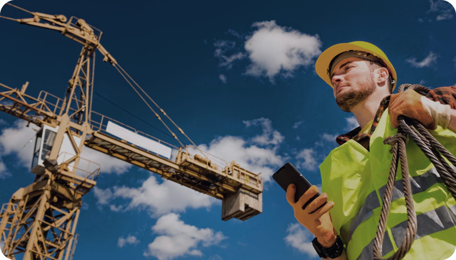 Worker interacting with machinery, scanning QR code for check-in and equipment location with GoBuid.